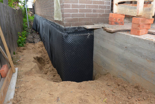 SJ Waterproofing Pros technician performing targeted Waterproofing assessment in Babylon, NY